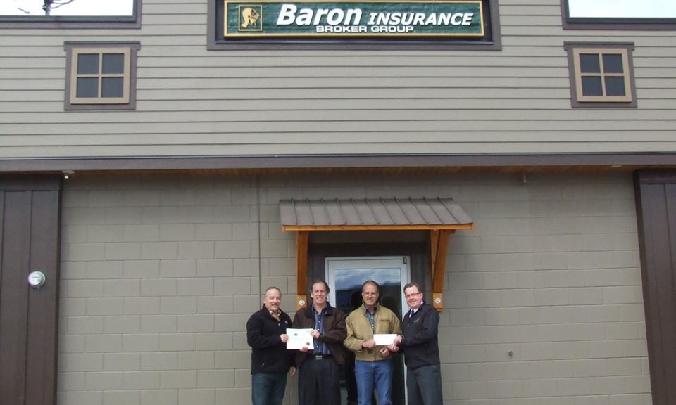 Mayor Cyr, Community Futures' Norm Metcalf along with Arne and Chuck of Baron Insurance, receiving an incentive cheque and certificate for participating in the City of Enderby's business beautification incentive program.