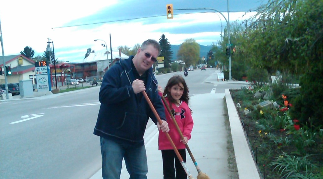 Councillor McCune and his daughter chipping in at the Enderby Clean-Up Challenge.