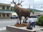 Artist Braden Kiefiuk of Majestic Metal Art affixes his deer sculpture to its base in Enderby