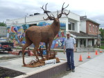 Braden Kiefiuk, artist, alongside his deer sculpture in Enderby