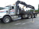 Central Hardware gets its crane ready to move the Majestic Metal Art deer sculpture into its new home north of Enderby City Hall