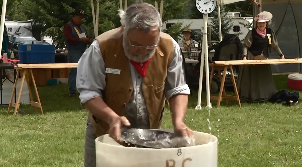 BC Open Gold Panning Championships 2014 photograph of participant panning for gold in Enderby BC