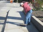 Bill Doorn Sweeping the Highway Sidewalk at Enderby Community Clean Up in 2015