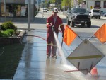 Fire Department Cleaning Sidewalks at Enderby Community Clean Up Day in 2015