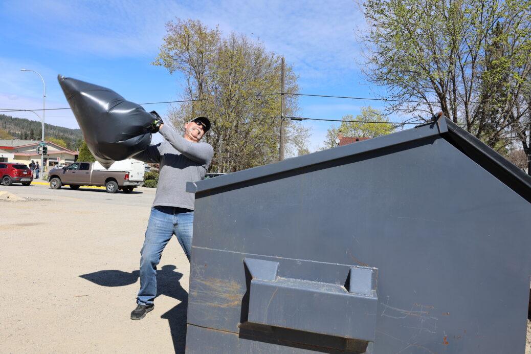 Wayne tossing garbage