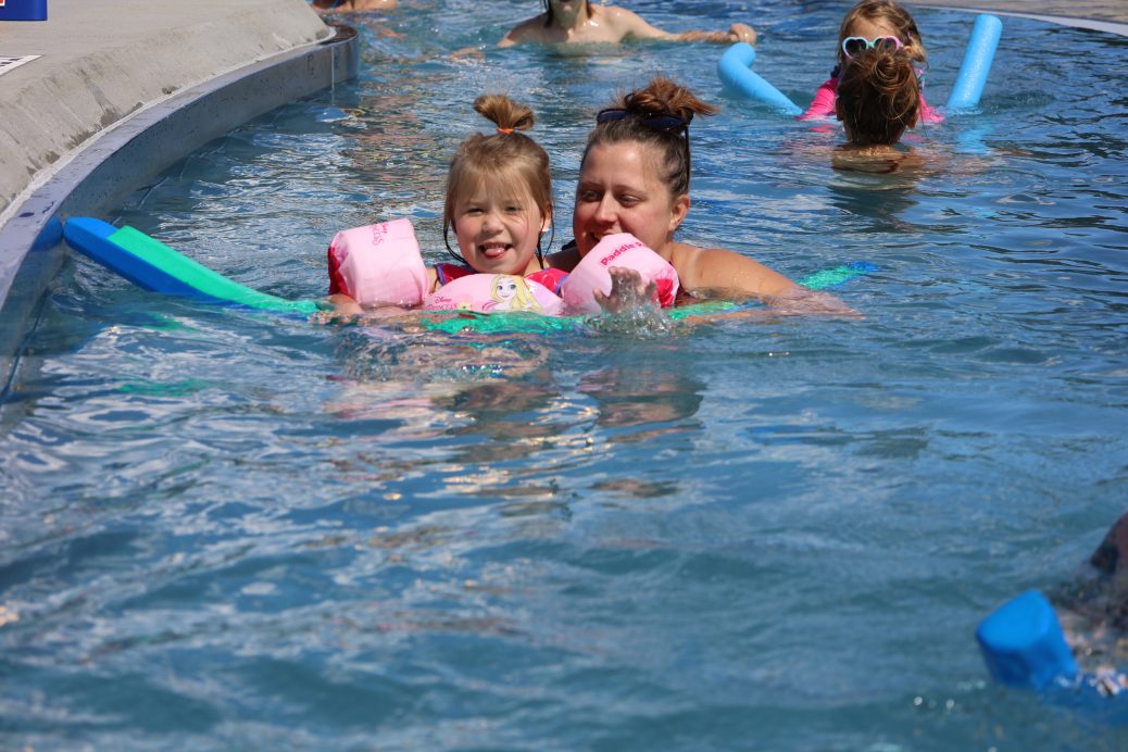 Mom & Daughter smiling in lazy river
