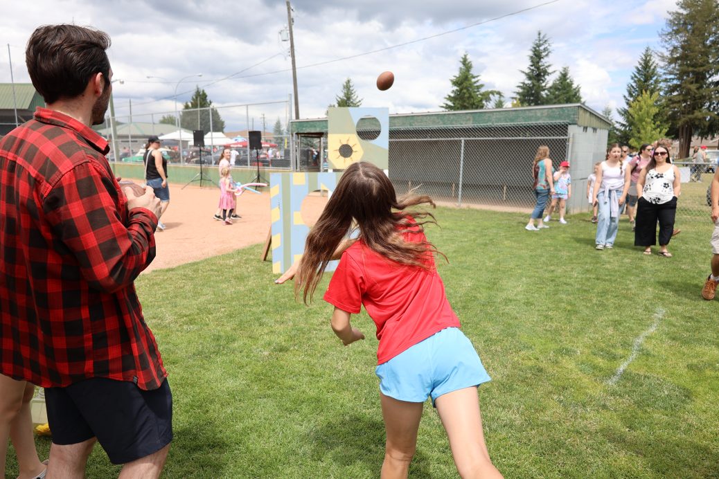 Girl throwing football Kids Zone