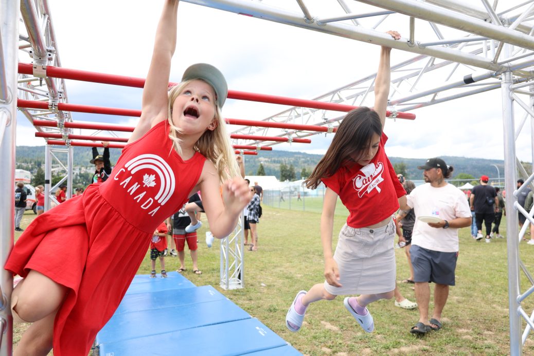 Girls racing on monkey bars